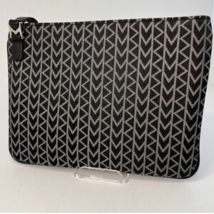 Michael Kors clutch purse in excellent condition with MK logo on entire purse.